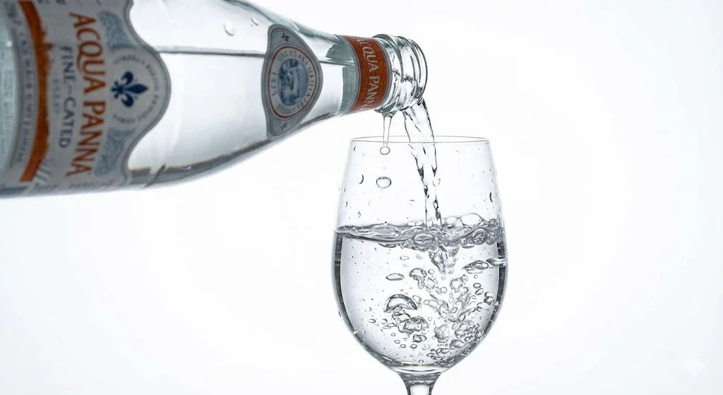 Pouring Acqua Panna Water into Glass
